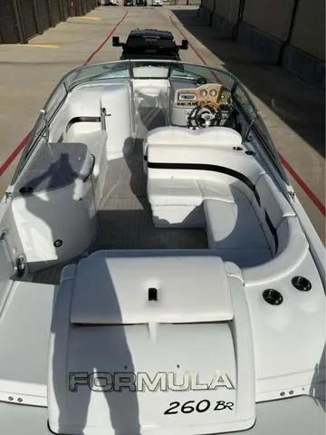 Slide: The Image of 2008 Formula 260 Bow Rider boat with spacious seating and sleek design. - 15