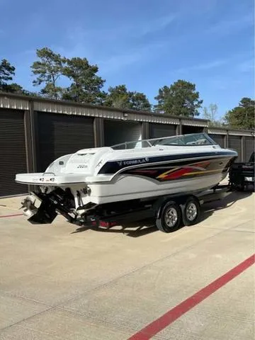 Slide: The Image of 2008 Formula 260 Bow Rider boat on trailer, parked outdoors. - 2
