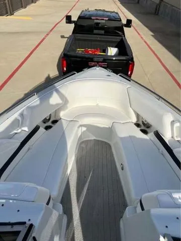 Slide: The Image of 2008 Formula 260 Bow Rider boat hitched to a black pickup truck. - 21