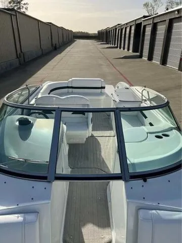 Slide: The Image of 2008 Formula 260 Bow Rider boat in storage facility, showcasing spacious seating and sleek design. - 4