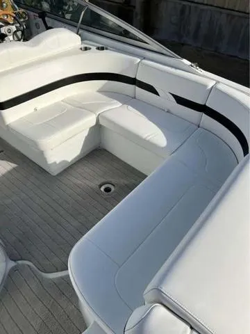 Slide: The Image of 2008 Formula 260 Bow Rider with white seating and sleek design. - 5