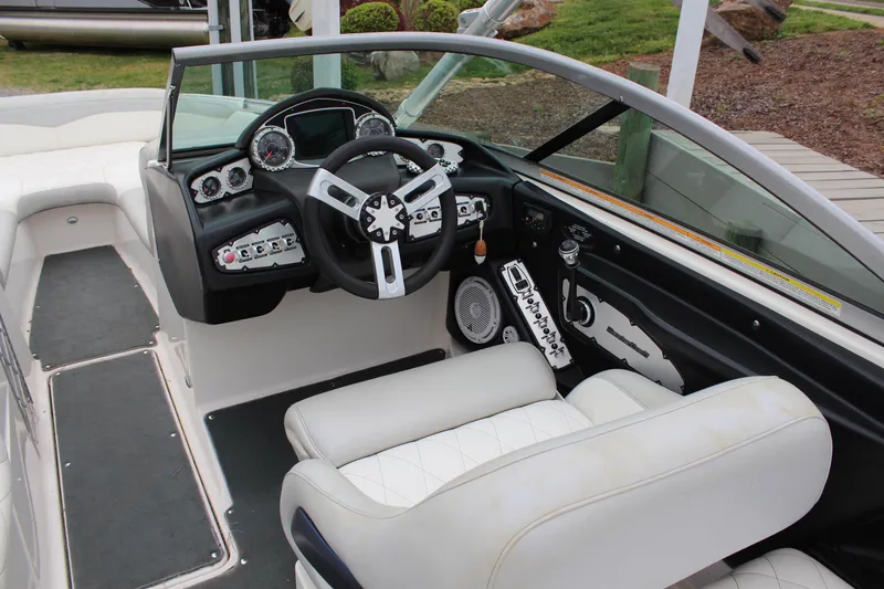 Slide: The Image of 2010 MasterCraft X-45 boat interior with steering wheel and dashboard controls. - 10