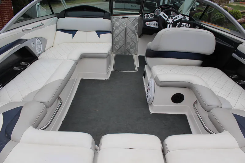 Slide: The Image of 2010 MasterCraft X-45 boat interior with spacious seating and modern dashboard. - 15