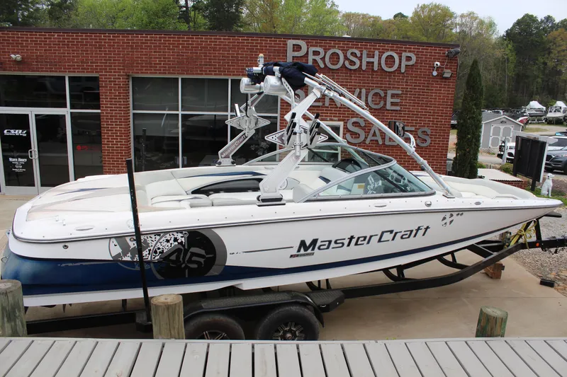 Slide: The Image of 2010 MasterCraft X-45 boat on trailer outside ProShop Service and Sales building. - 4