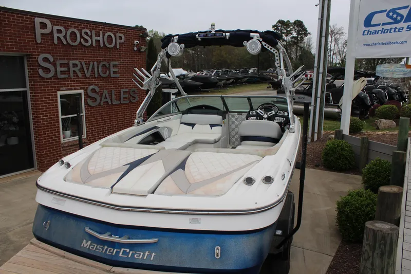 Slide: The Image of 2010 MasterCraft X-45 boat displayed at a pro shop service and sales location. - 5