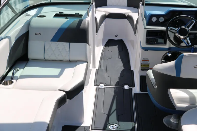 Slide: The Image of 2018 Regal 23 RX Surf boat interior with modern seating and dashboard design. - 25