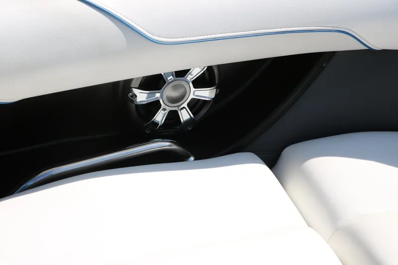 Slide: The Image of 2018 Regal 23 RX Surf boat interior with speaker and white seating. - 27