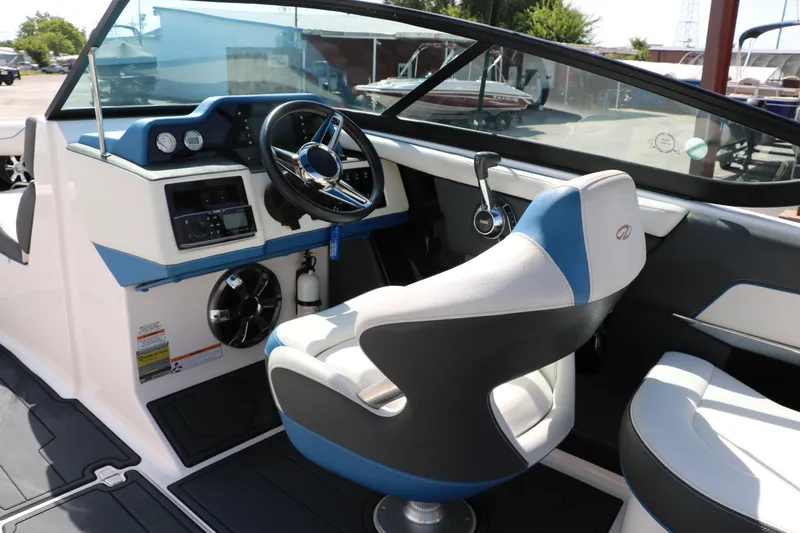 Slide: The Image of 2018 Regal 23 RX Surf boat interior with steering wheel and seating. - 32