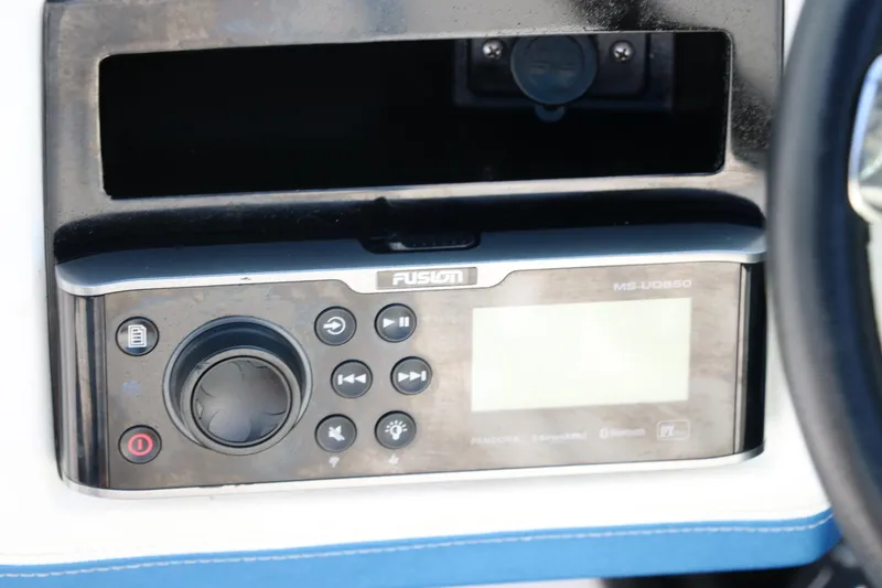 Slide: The Image of Fusion marine stereo system on a 2018 Regal 23 RX Surf boat dashboard. - 37