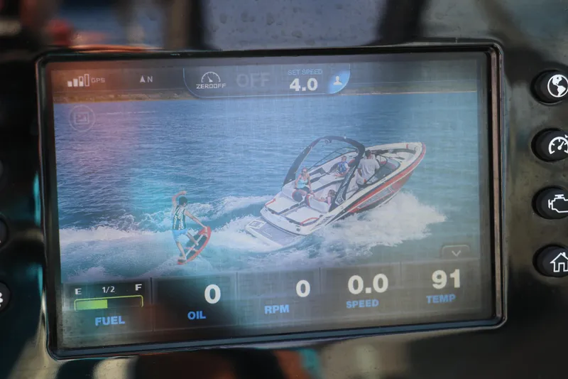 Slide: The Image of Dashboard display of a 2018 Regal 23 RX Surf boat showing wakeboarding activity. - 43
