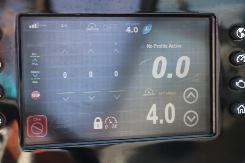 Slide: The Image of Dashboard display of a 2018 Regal 23 RX Surf boat showing speed and settings. - 44