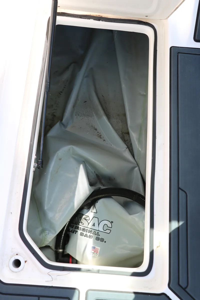 Slide: The Image of Storage compartment of 2018 Regal 23 RX Surf boat with ballast bag. - 46