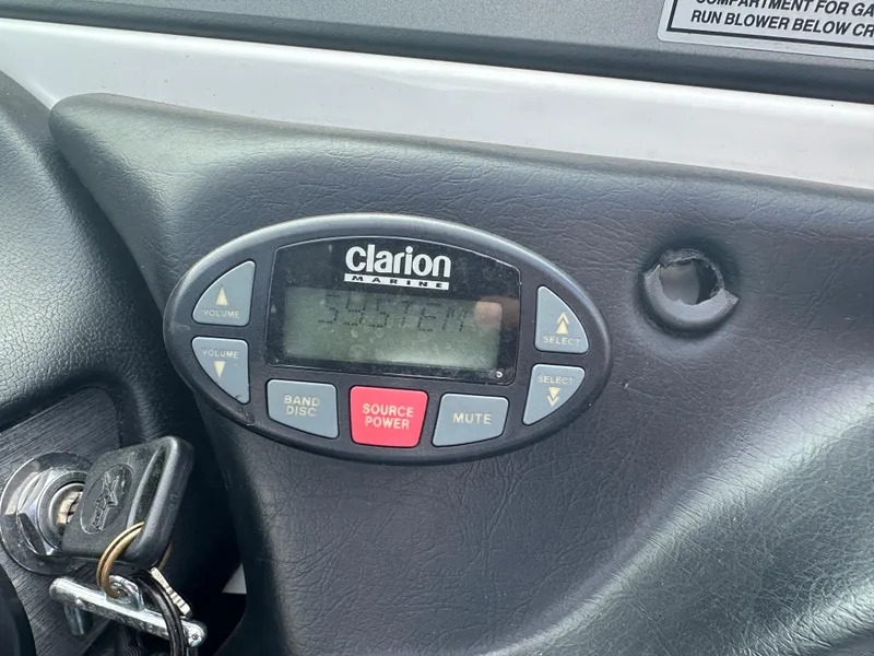 Slide: The Image of 2004 MasterCraft ProStar 209 dashboard with Clarion Marine audio system and ignition keys. - 10