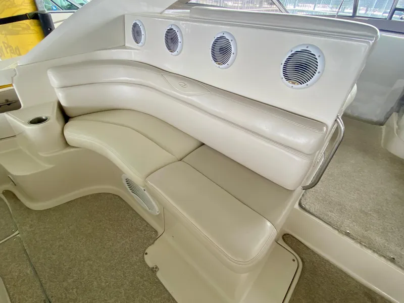 Slide: The Image of Luxurious seating area on a 2001 Regal Commodore 4160 boat, featuring plush white upholstery. - 11