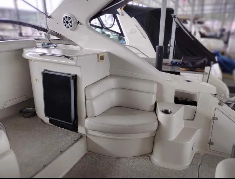 Slide: The Image of Interior of 2001 Regal Commodore 4160 yacht with seating and kitchenette area. - 12