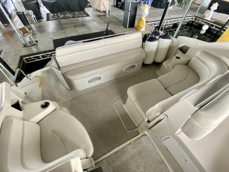 Slide: The Image of 2001 Regal Commodore 4160 boat interior with beige seating and docked setting. - 18