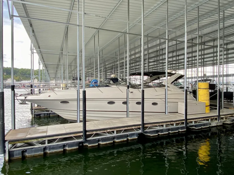 Slide: The Image of 2001 Regal Commodore 4160 yacht docked under covered marina. - 2
