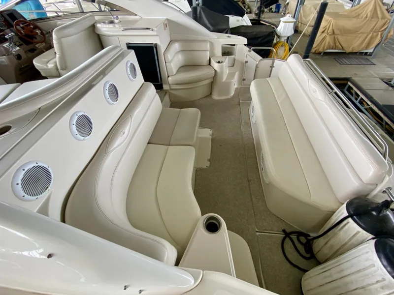 Slide: The Image of 2001 Regal Commodore 4160 yacht interior with white leather seating and built-in speakers. - 20