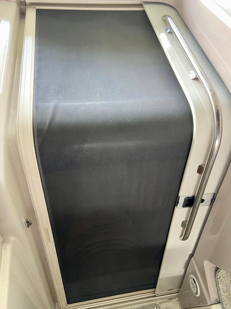 Slide: The Image of 2001 Regal Commodore 4160 cabin door with screen, showcasing sleek design and functionality. - 26