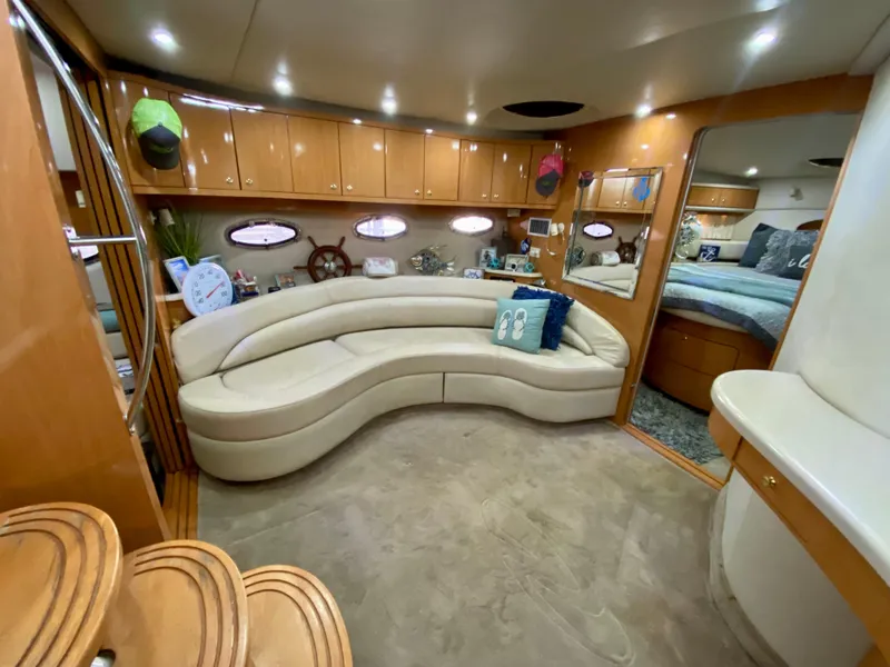 Slide: The Image of Luxurious interior of 2001 Regal Commodore 4160 yacht with curved seating and elegant decor. - 27