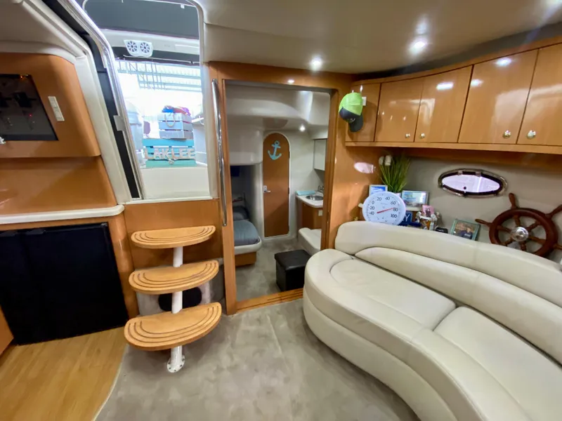 Slide: The Image of Luxurious interior of 2001 Regal Commodore 4160 yacht with plush seating and wooden accents. - 35