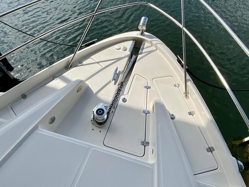 Slide: The Image of Bow of 2001 Regal Commodore 4160 yacht with anchor chain and railing. - 4