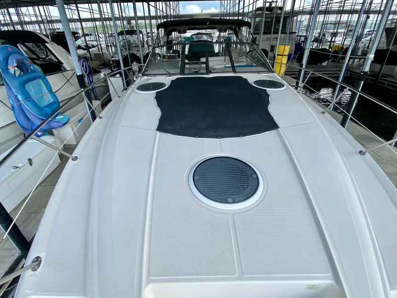 Slide: The Image of 2001 Regal Commodore 4160 yacht docked, featuring spacious deck and sleek design. - 6