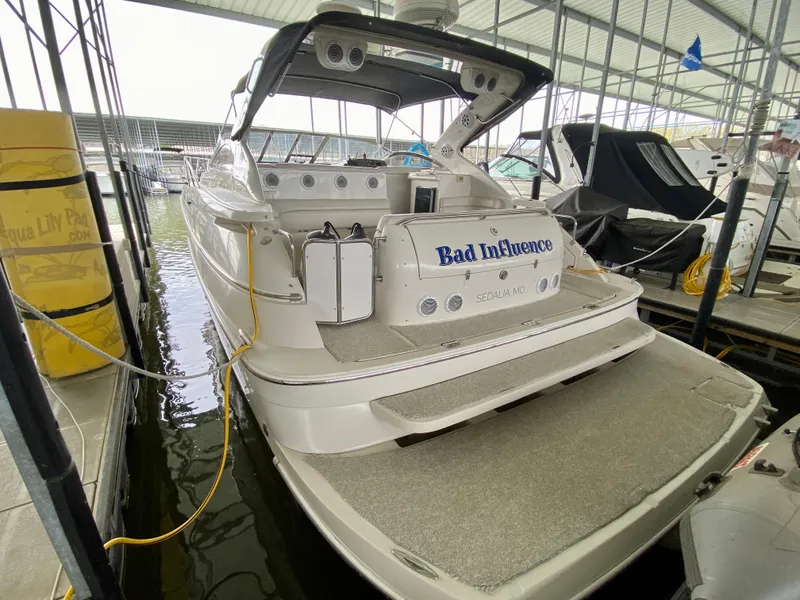 Slide: The Image of 2001 Regal Commodore 4160 yacht docked in marina, rear view. - 7