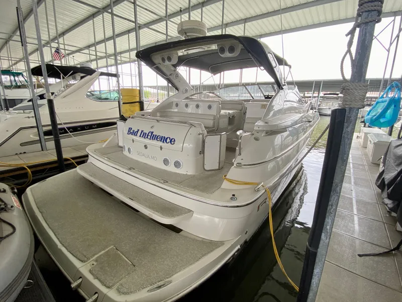 Slide: The Image of 2001 Regal Commodore 4160 yacht docked in a covered marina. - 8