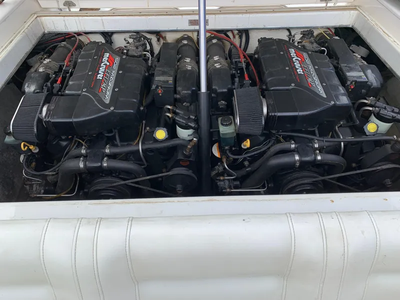 Slide: The Image of Twin engines in a 1996 Fountain 32 Fever boat, showcasing powerful performance. - 11
