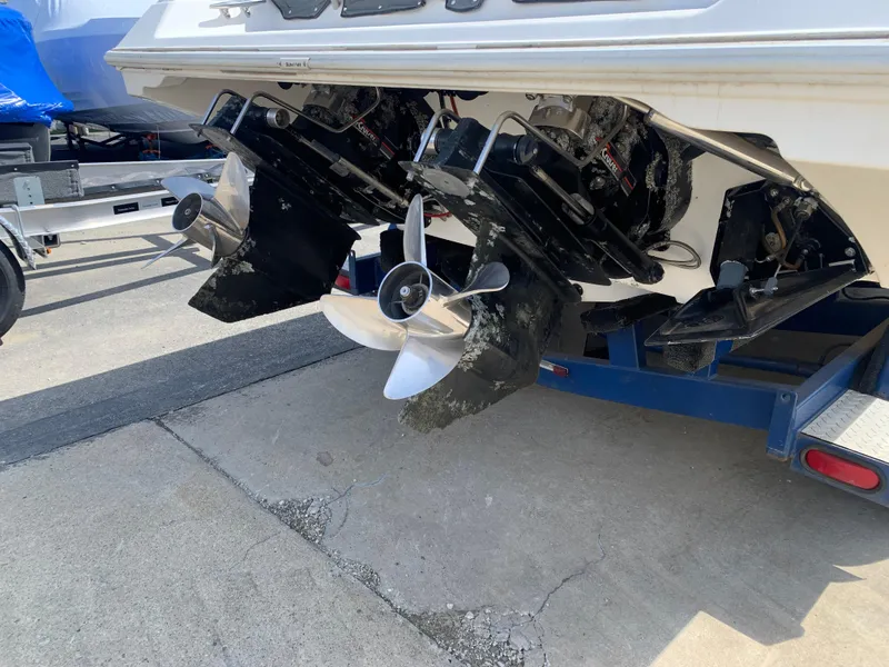 Slide: The Image of 1996 Fountain 32 Fever boat with dual propellers on a trailer. - 13