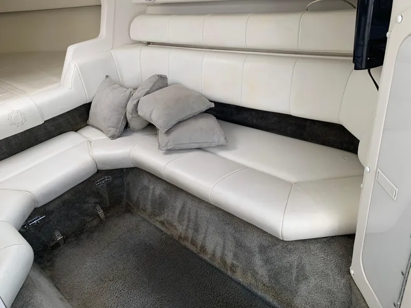 Slide: The Image of Interior of 1996 Fountain 32 Fever boat with white leather seating and gray carpet. - 2