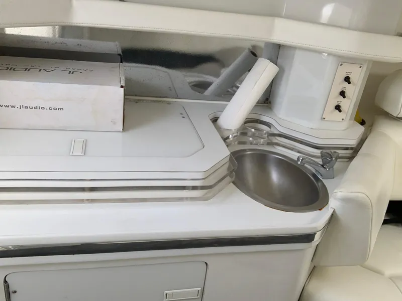 Slide: The Image of Interior of a 1996 Fountain 32 Fever boat with sink and storage area. - 4