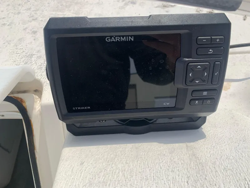 Slide: The Image of Garmin Striker CV fishfinder on 1996 Fountain 32 Fever boat dashboard. - 8