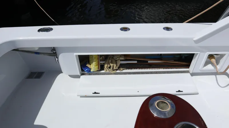Slide: The Image of Storage compartment on a 2002 Miller Marine Express boat deck. - 20