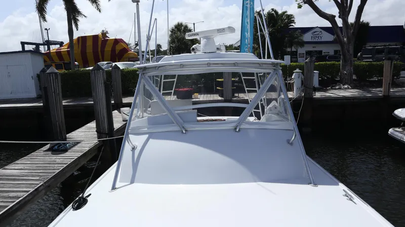 Slide: The Image of 2002 Miller Marine Express boat docked at marina, rear view. - 5