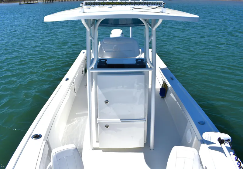 Slide: The Image of 2023 Pair Customs 24 Center Console MV boat on water, showcasing sleek design and spacious deck. - 15