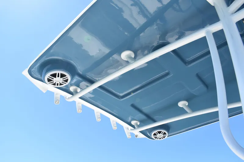 Slide: The Image of 2023 Pair Customs 24 Center Console MV boat roof with speakers and rod holders. - 19