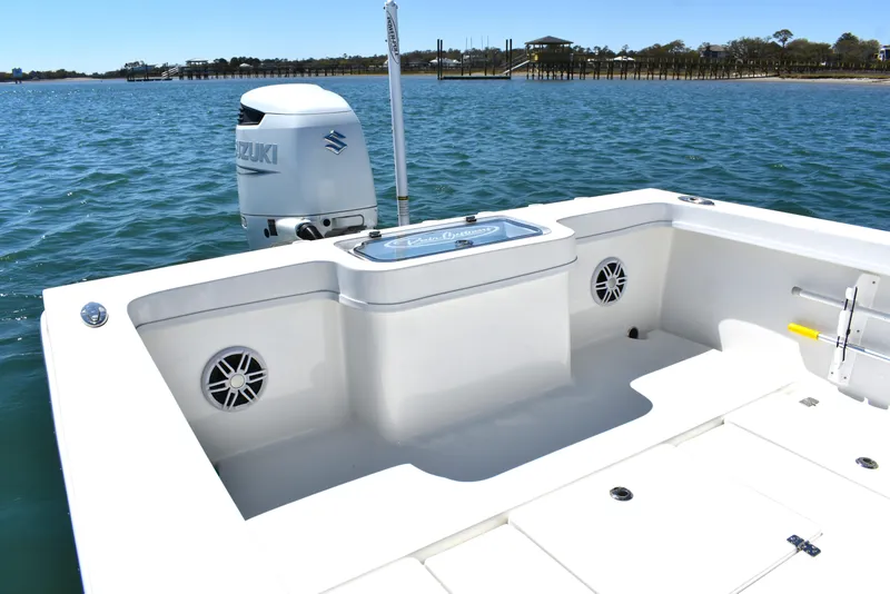 Slide: The Image of 2023 Pair Customs 24 Center Console MV boat with Suzuki outboard motor on calm water. - 20