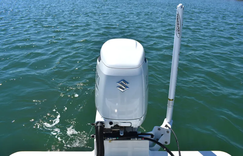 Slide: The Image of 2023 Pair Customs 24 Center Console MV with Suzuki outboard on water. - 21