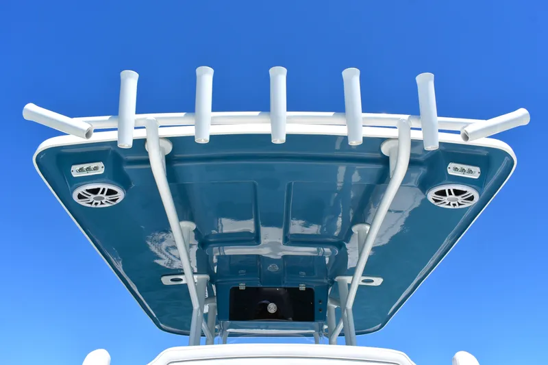Slide: The Image of 2023 Pair Customs 24 Center Console MV boat roof with rod holders and speakers. - 23