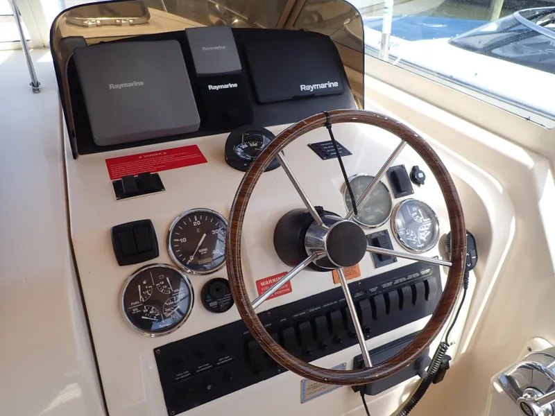 Slide: The Image of Helm of 2004 Mainship 34 Rum Runner II with Raymarine navigation equipment. - 13