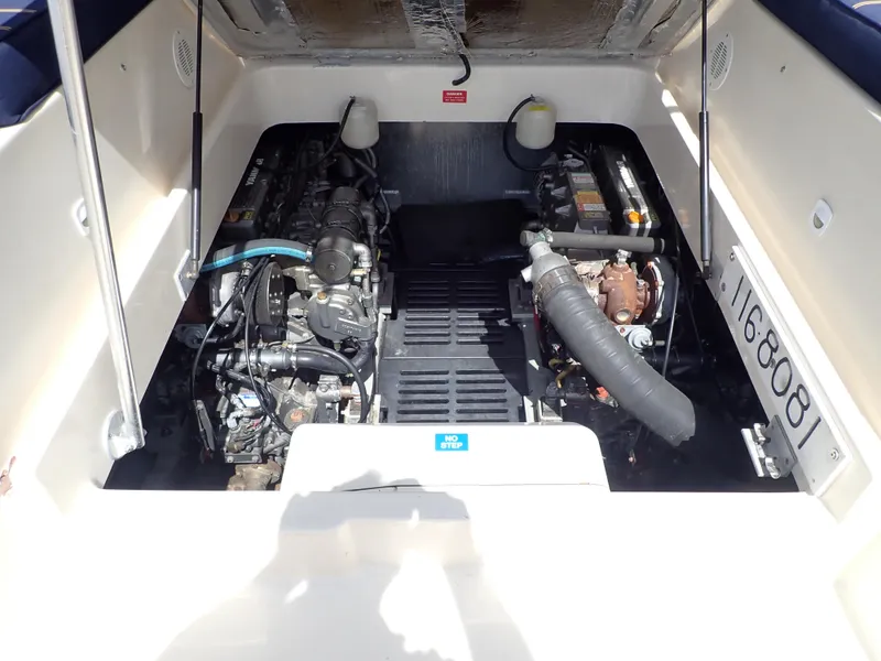 Slide: The Image of Engine compartment of 2004 Mainship 34 Rum Runner II, showcasing dual engines and mechanical components. - 40