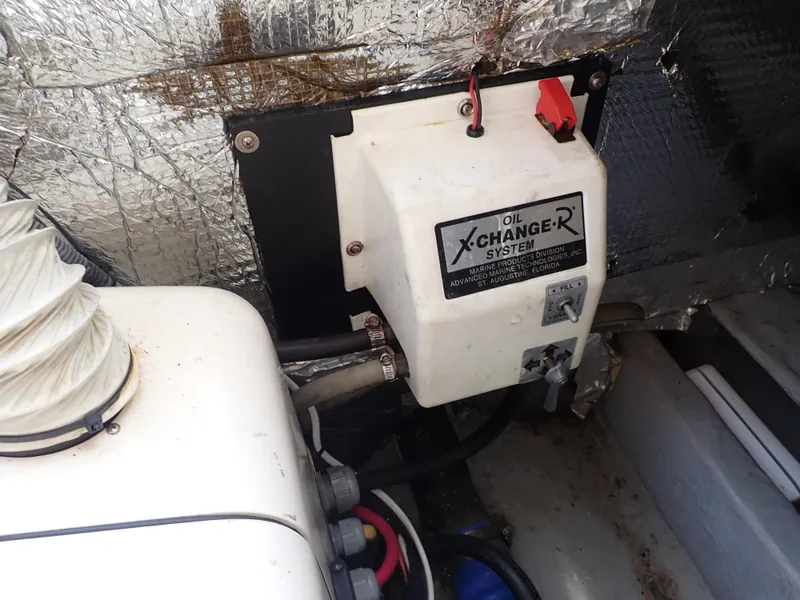 Slide: The Image of Engine compartment of 2004 Mainship 34 Rum Runner II with oil changer system. - 42