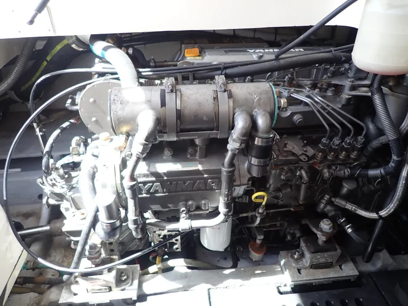 Slide: The Image of Engine of 2004 Mainship 34 Rum Runner II boat, showcasing Yanmar components. - 43