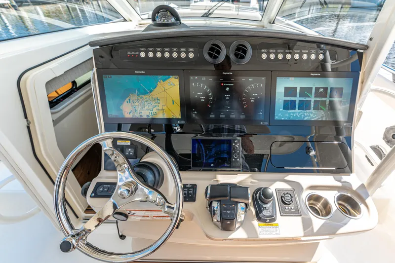 Slide: The Image of 2019 Boston Whaler 420 Outrage interior with electronic display and speaker. - 46