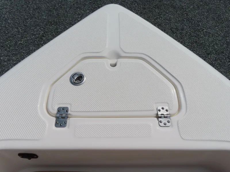 Slide: The Image of 2019 Key West 176 Center Console boat hatch with textured surface and metal hinges. - 10