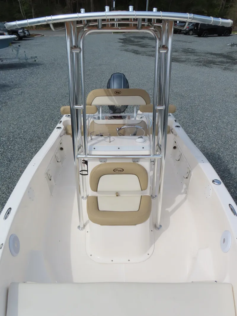 Slide: The Image of 2019 Key West 176 Center Console boat with beige seating and stainless steel frame. - 12