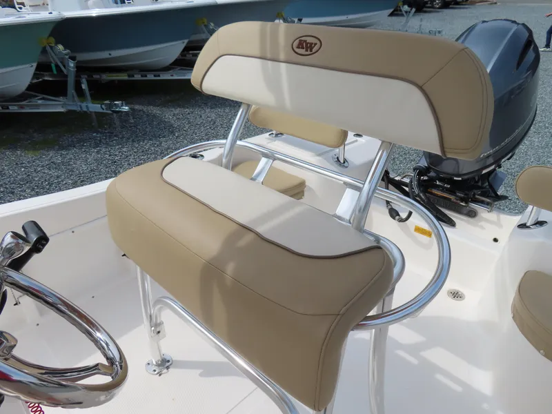 Slide: The Image of 2019 Key West 176 Center Console boat seat with beige and white upholstery. - 18