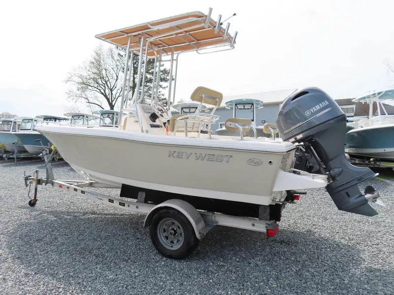 Slide: The Image of 2019 Key West 176 Center Console boat with Yamaha outboard motor on a trailer. - 2
